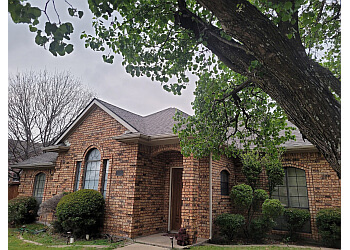 Completed roof on a brick home in the Garland area