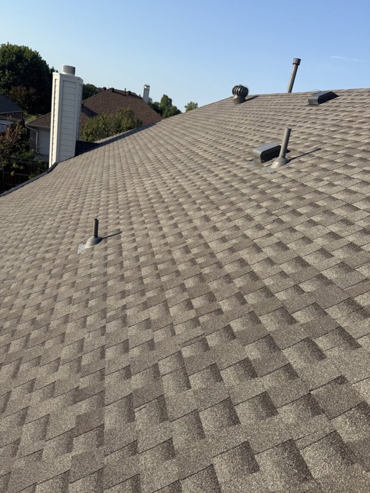 Close-up of new shingles and updated roof vents