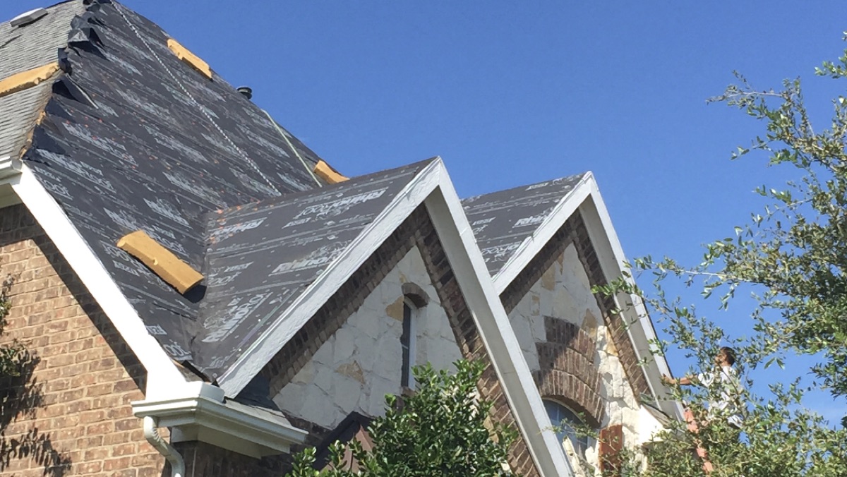 Roof deck covered in underlayment mid-replacement
